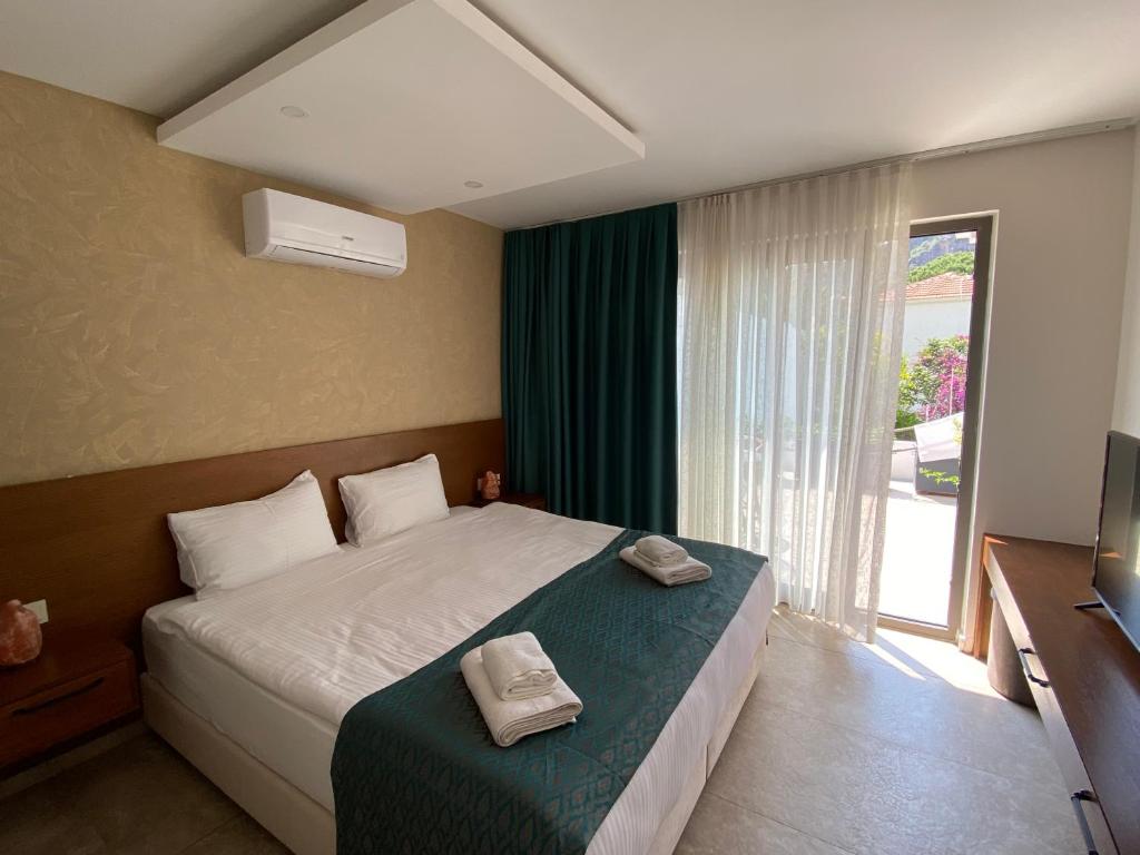 Postel nebo postele na pokoji v ubytování On Oda Oludeniz