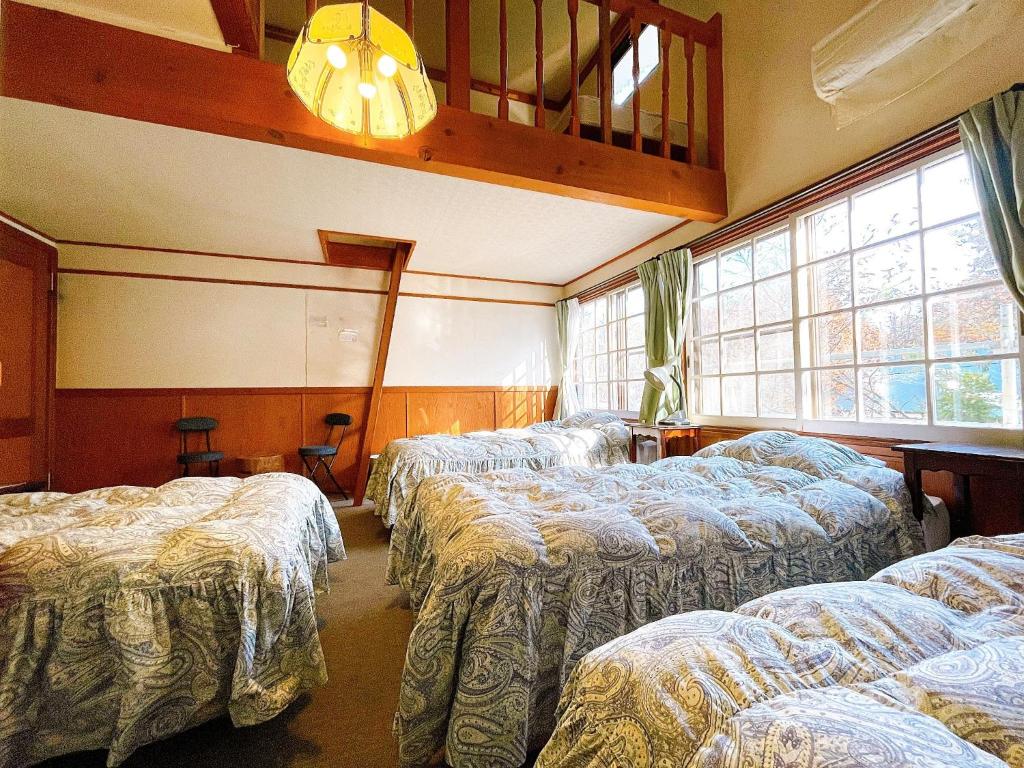 Posteľ alebo postele v izbe v ubytovaní Hakuba Pension Meteor - Vacation STAY 63293v
