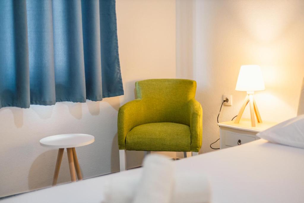 Una cama o camas en una habitación de Barba Rooms