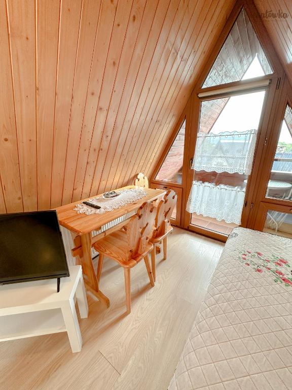 TV a/nebo společenská místnost v ubytování Willa Michałówka Attic