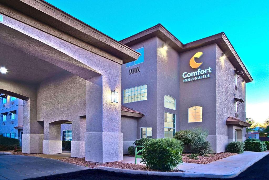 a building with a sign on the side of it at Comfort Inn & Suites Sierra Vista near Ft Huachuca in Sierra Vista