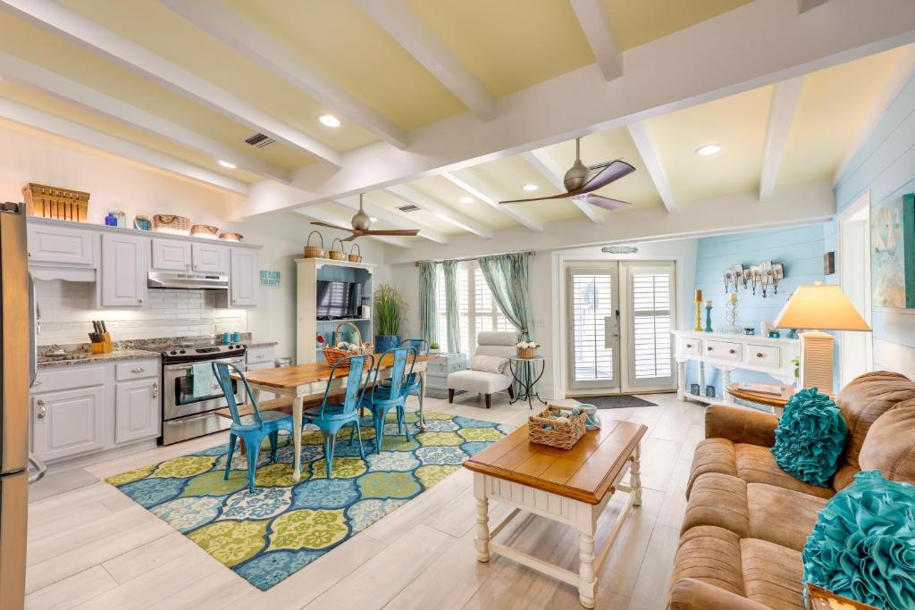 a kitchen and living room with a couch and a table at Pet-Friendly Jekyll Island Abode - Walk to Beach! in Jekyll Island