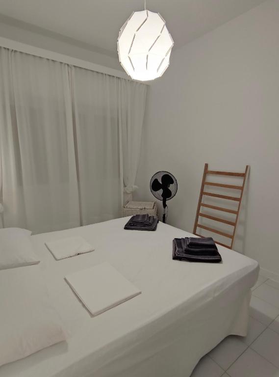 Postel nebo postele na pokoji v ubytování Cozy Seaview Apartment
