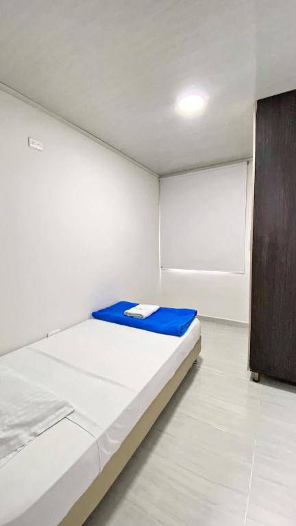Postel nebo postele na pokoji v ubytování Apartahotel222 Pereira 401