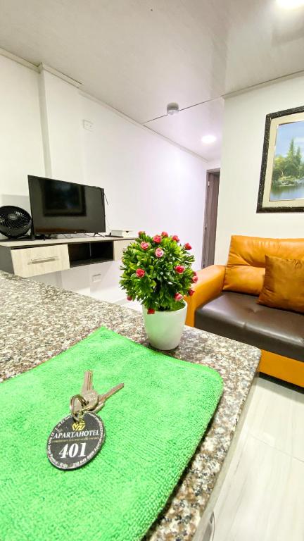 TV a/nebo společenská místnost v ubytování Apartahotel222 Pereira 401