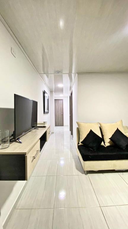 TV a/nebo společenská místnost v ubytování Apartahotel222 Pereira 403