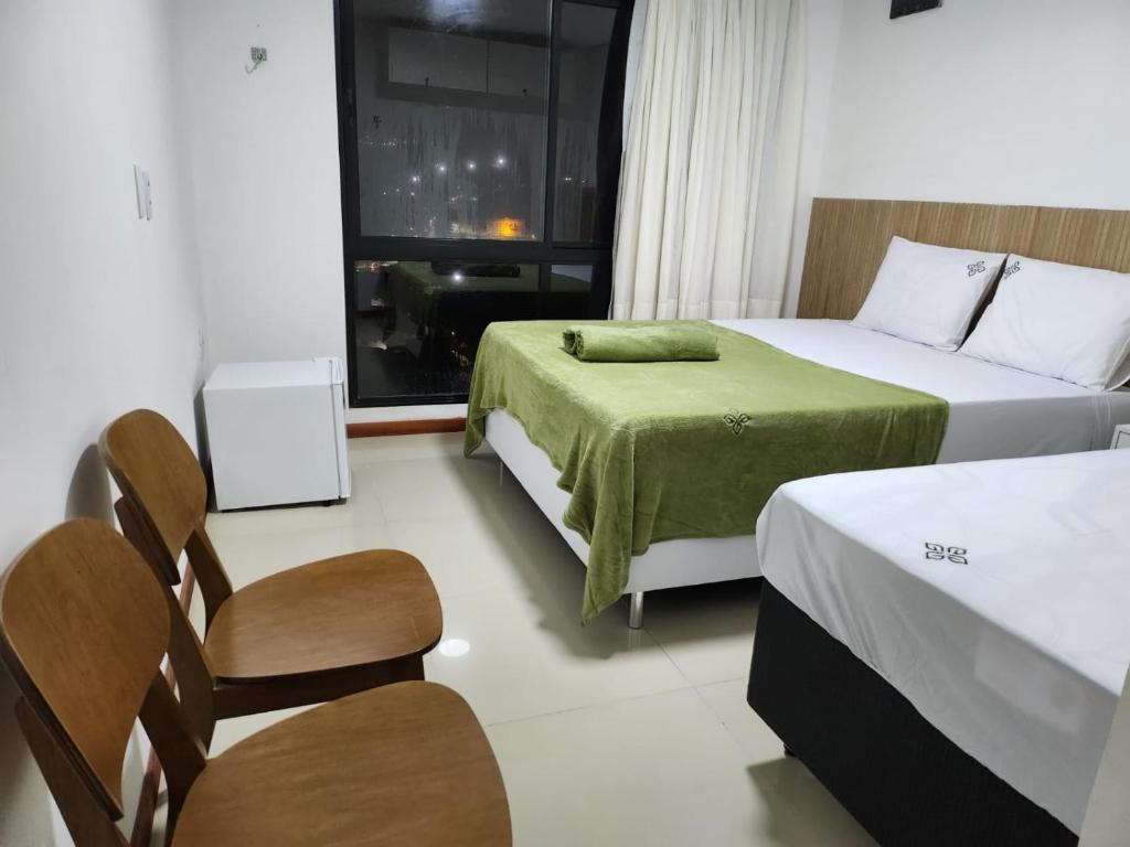 Tempat tidur dalam kamar di Apt 202 e 203 no ZUPPOLINI GARDEN HOTEL Bananeiras PB