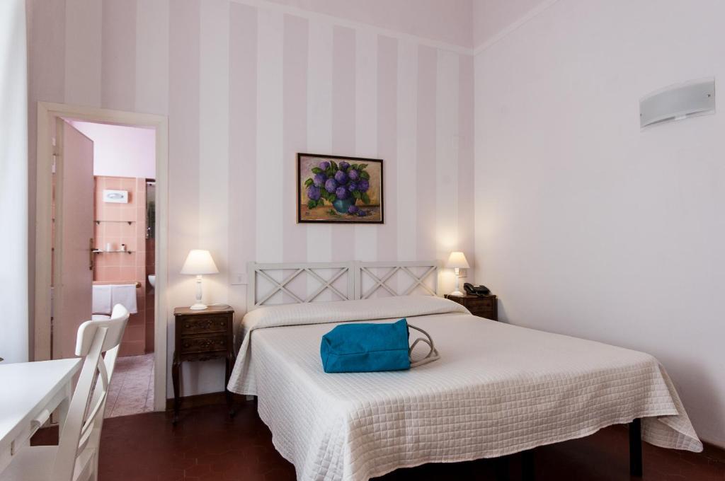 Postel nebo postele na pokoji v ubytování Hotel Club i Pini - Residenza d'Epoca in Versilia
