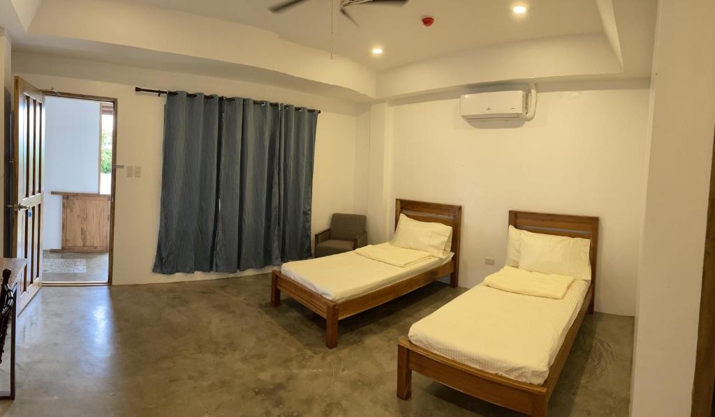 Postel nebo postele na pokoji v ubytování P&B Residences Legazpi