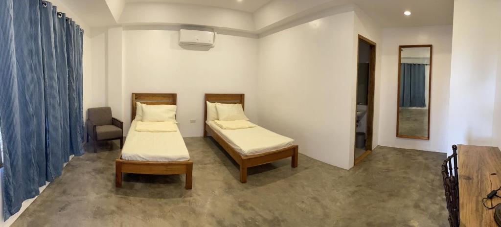 Postel nebo postele na pokoji v ubytování P&B Residences Legazpi