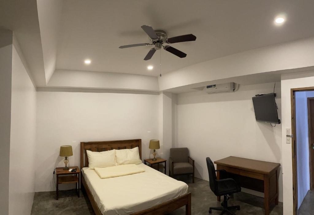 Postel nebo postele na pokoji v ubytování P&B Residences Legazpi