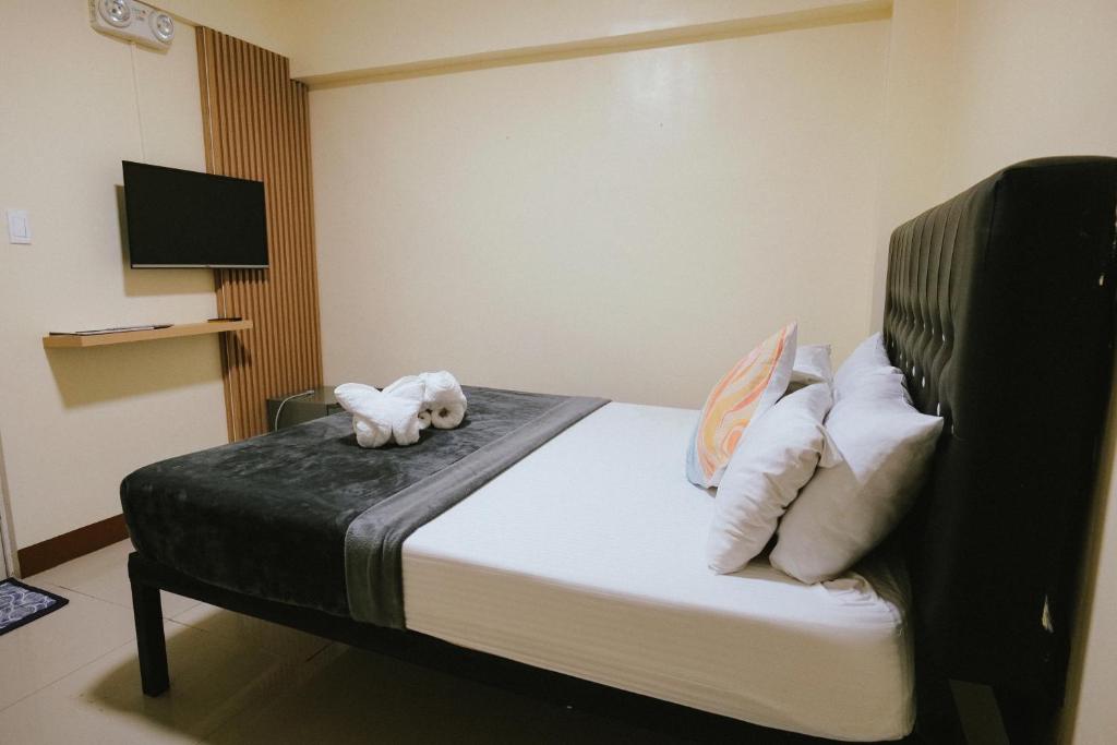Postel nebo postele na pokoji v ubytování Boracay Grace Hotel