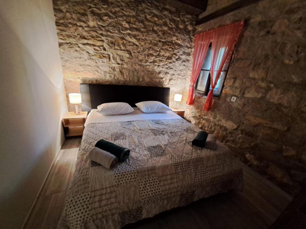 Postel nebo postele na pokoji v ubytování Apartman Zrinka
