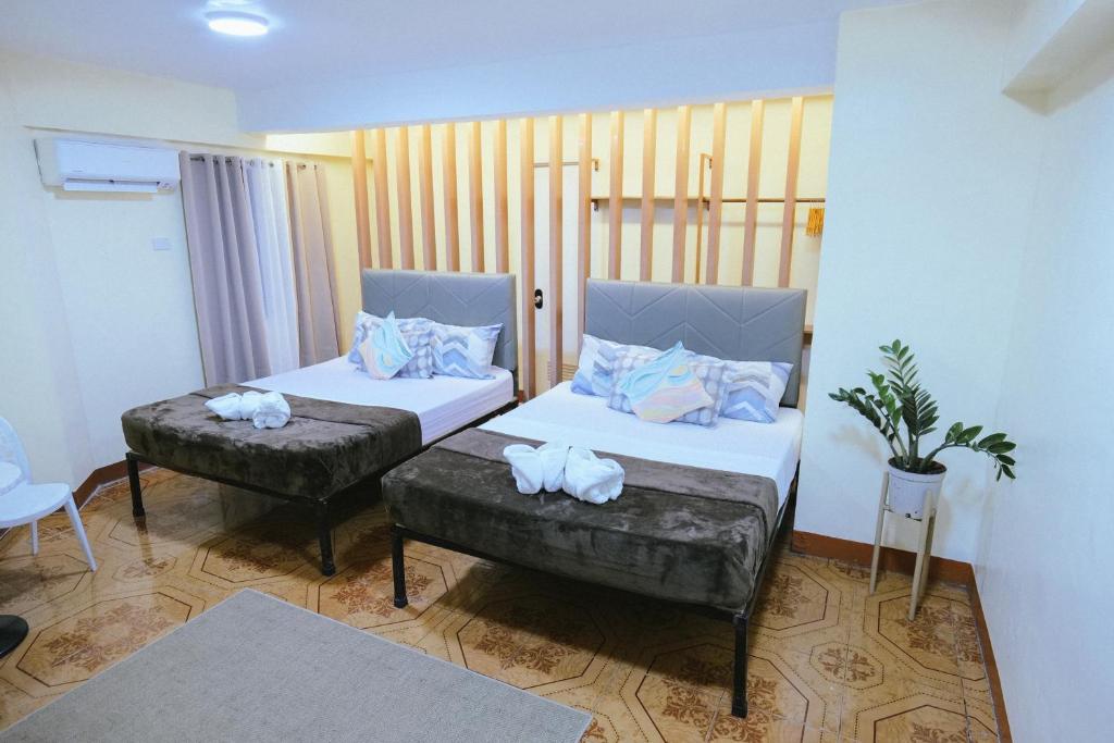 Postel nebo postele na pokoji v ubytování Boracay Grace Hotel