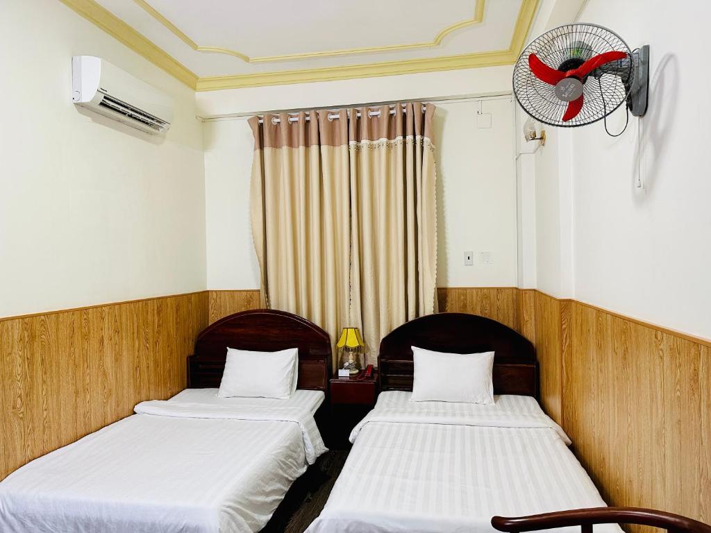 Postel nebo postele na pokoji v ubytování Khách sạn Mekong Star