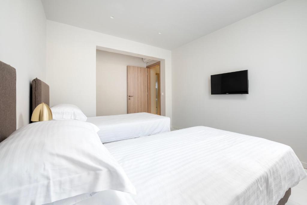 Postel nebo postele na pokoji v ubytování Smaragdi Kos Hotel
