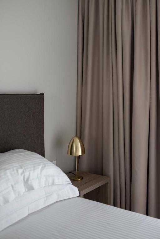 Postel nebo postele na pokoji v ubytování Smaragdi Kos Hotel