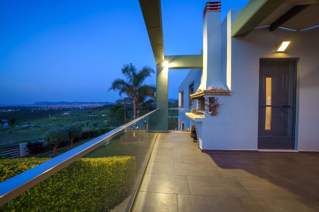 A balcony or terrace at Mythic Olive villa - Heated Pool - Amazing view