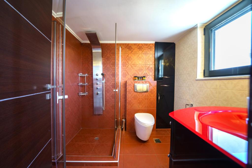 A bathroom at Mythic Olive villa - Heated Pool - Amazing view