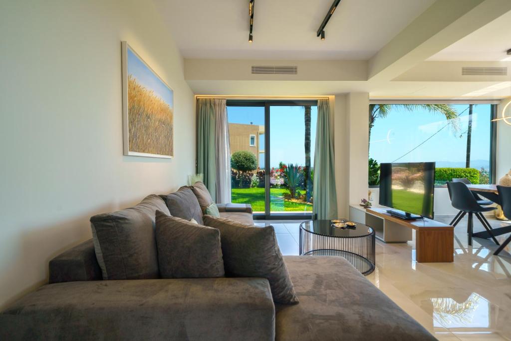 A seating area at Mythic Olive villa - Heated Pool - Amazing view