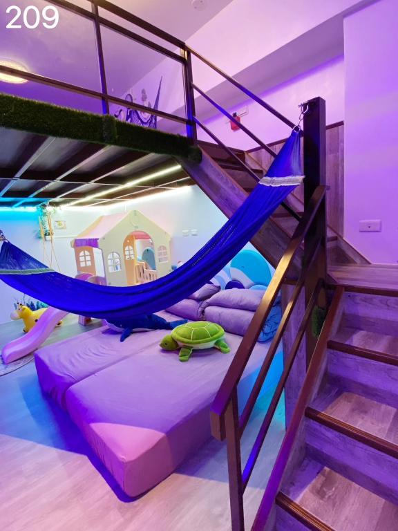 Postel nebo postele na pokoji v ubytování Wind Natural Parent-Child Inn II
