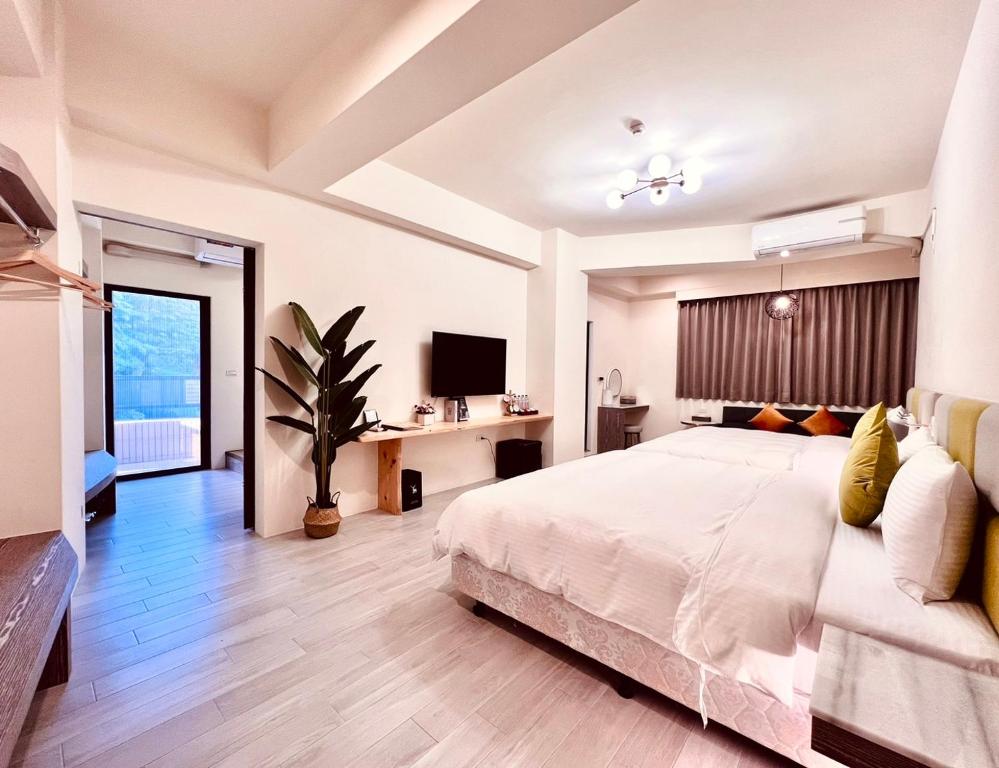 Voodi või voodid majutusasutuse 沛青日旅民宿 PQ Room toas