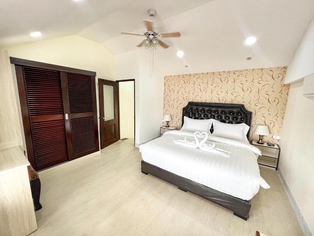 A bed or beds in a room at Dao Residence Boutique Apartment