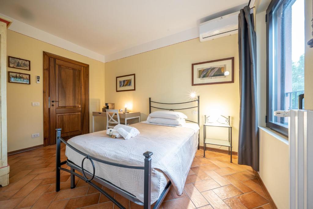 Postel nebo postele na pokoji v ubytování Casello A1, Modena sud - Villa Aurora Charming Rooms