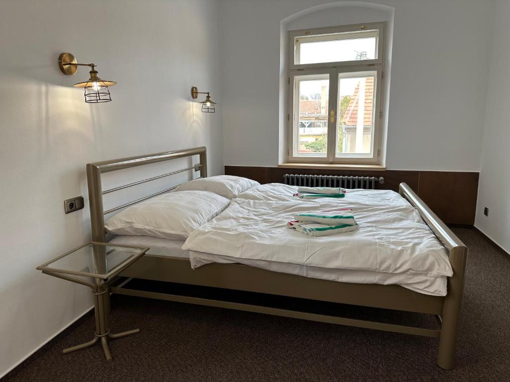 Postel nebo postele na pokoji v ubytování VAPARTMANY