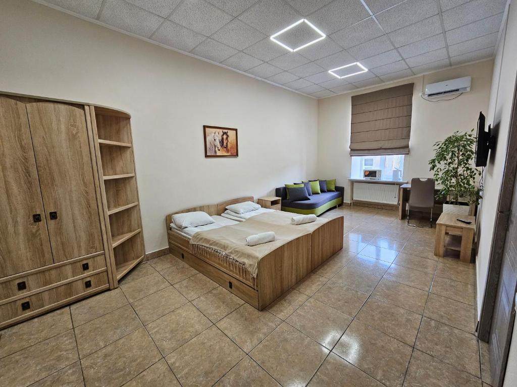 Postel nebo postele na pokoji v ubytování Coin Apartments & Poshtel