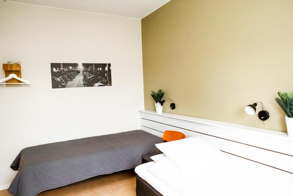 Postel nebo postele na pokoji v ubytování Spångholmen Bed & Breakfast AB