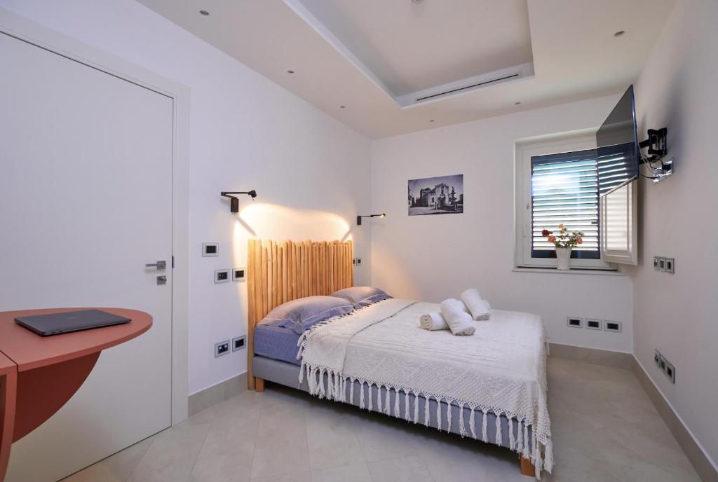 Postel nebo postele na pokoji v ubytování Corvaja Inn