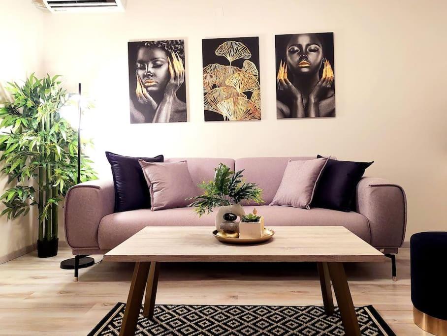 a living room with a couch and a table at Cherry's apartment in Alonnisos Old Town