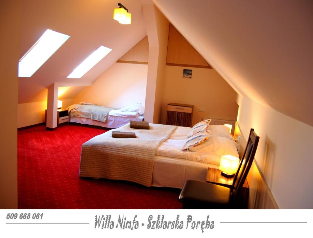 Posteľ alebo postele v izbe v ubytovaní Willa Nimfa pokoje i apartamenty, również cała willa na wyłączność