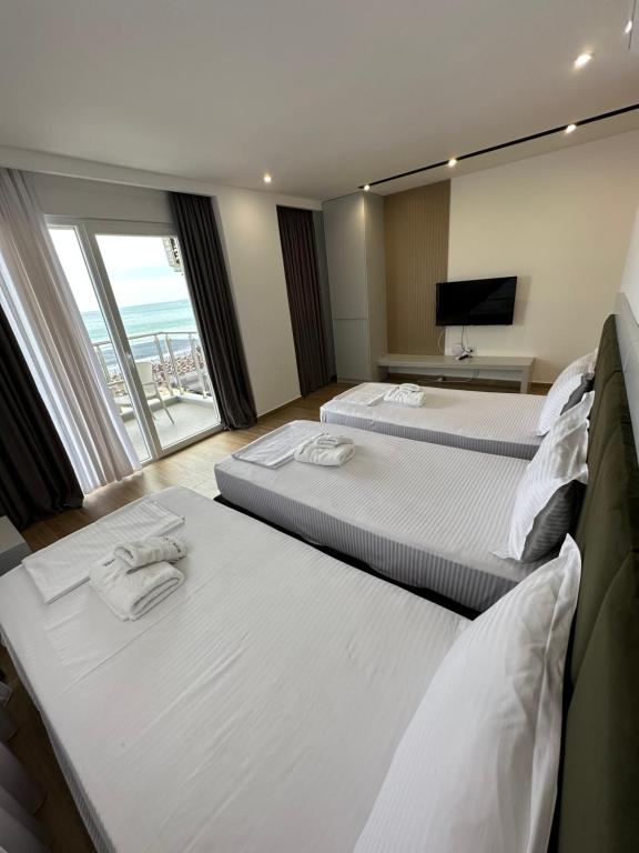 Postel nebo postele na pokoji v ubytování Suite Hotel