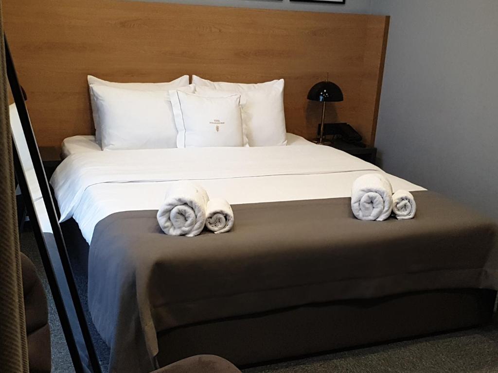 Postel nebo postele na pokoji v ubytování Hotel Tuta