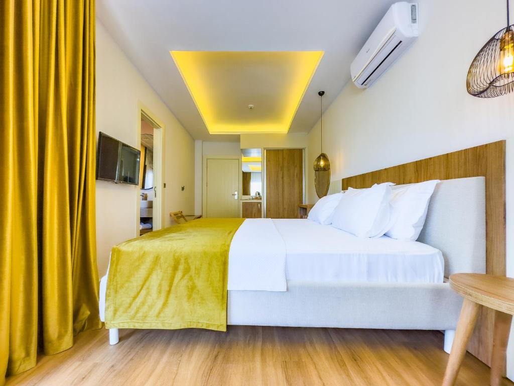 Postel nebo postele na pokoji v ubytování Dedeoğlu Port Hotel