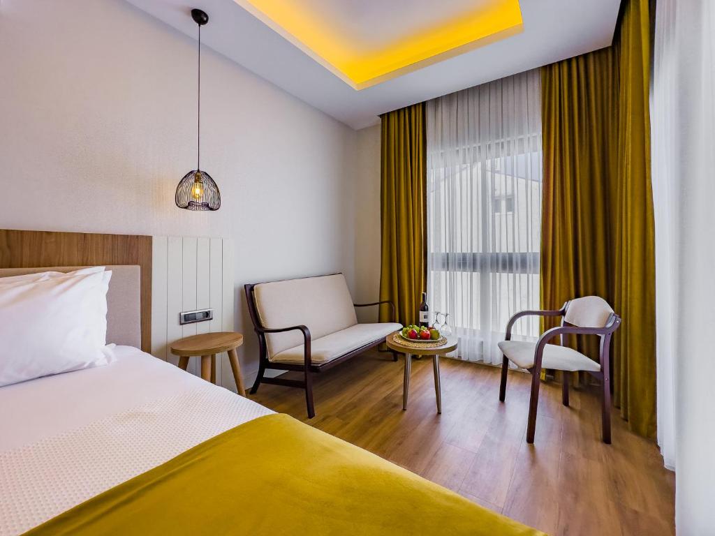 Postel nebo postele na pokoji v ubytování Dedeoğlu Port Hotel