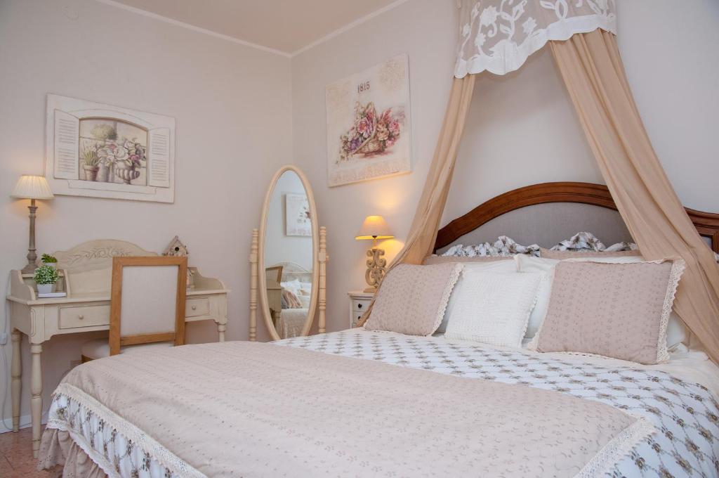 Łóżko lub łóżka w pokoju w obiekcie Vacanze Romantiche a Modica