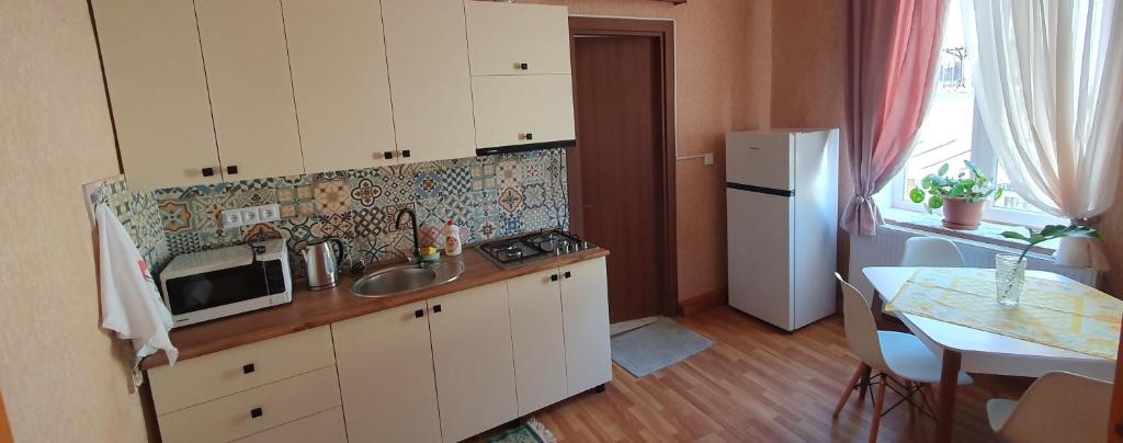 Kuchyň nebo kuchyňský kout v ubytování Bookinist Apartment