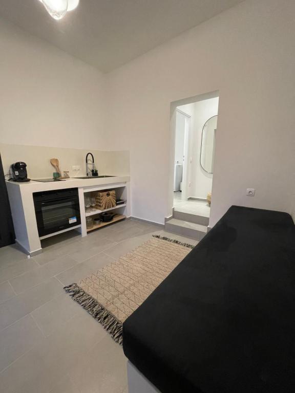 a living room with a table and a sink at Vie rêvée luxury suites in Ganema