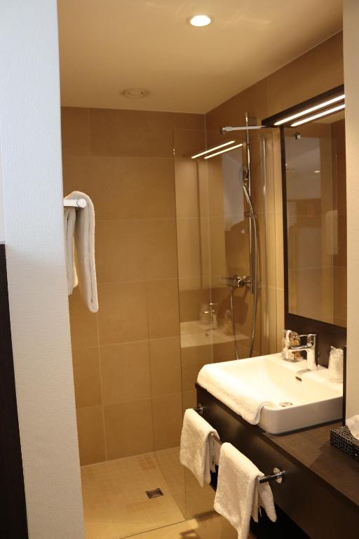 Koupelna v ubytování EINSTEIN Hotel am Römerpark
