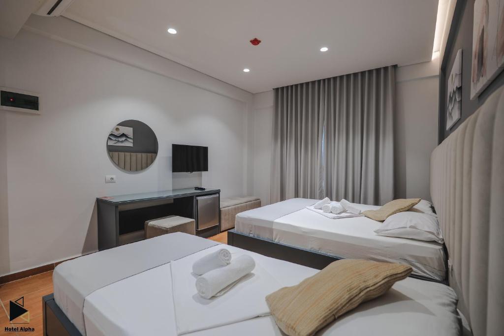 Postel nebo postele na pokoji v ubytování Hotel Alpha
