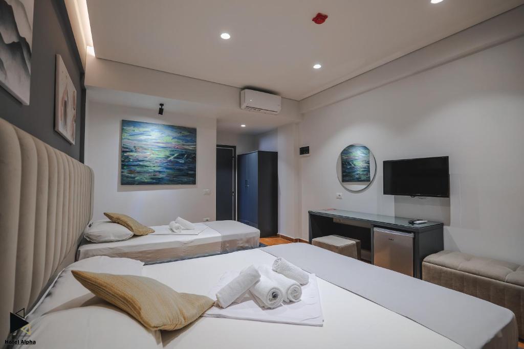 Postel nebo postele na pokoji v ubytování Hotel Alpha