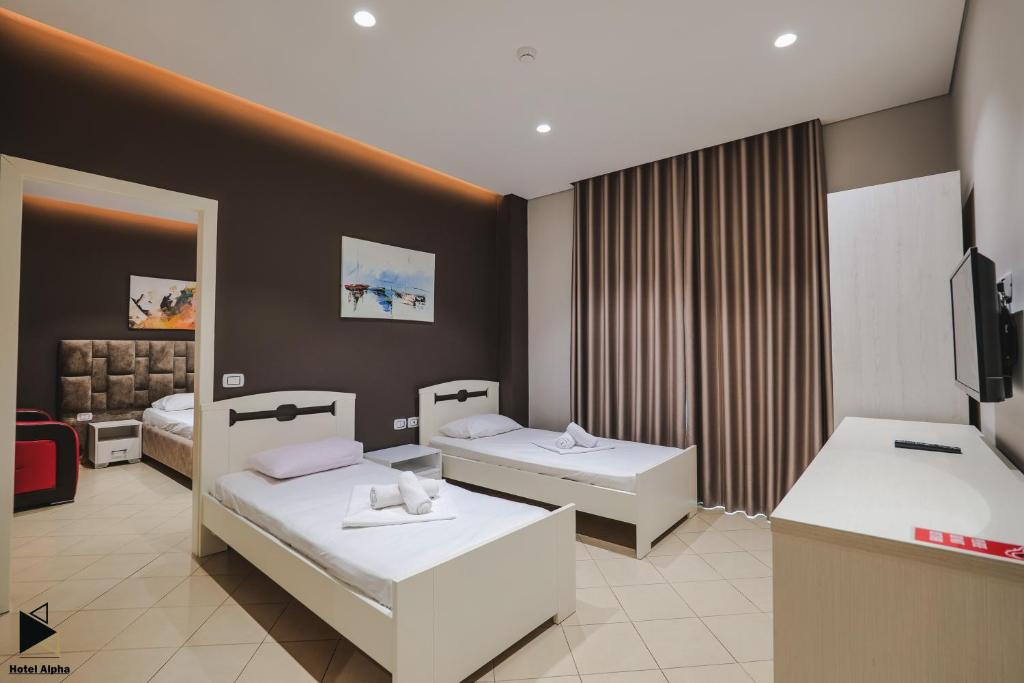 TV a/nebo společenská místnost v ubytování Hotel Alpha