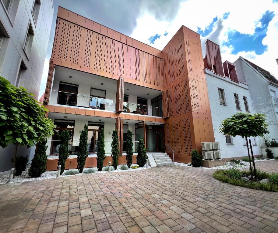 a building with a brick driveway in front of it at Argo Apartments in Ljubljana