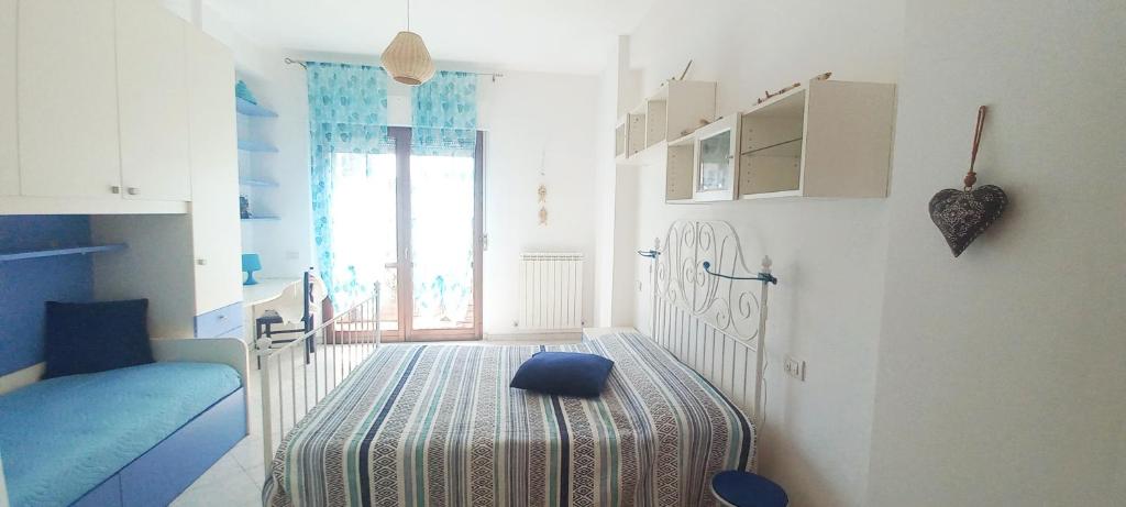 Кровать или кровати в номере Blu Mare_Attico con Vista