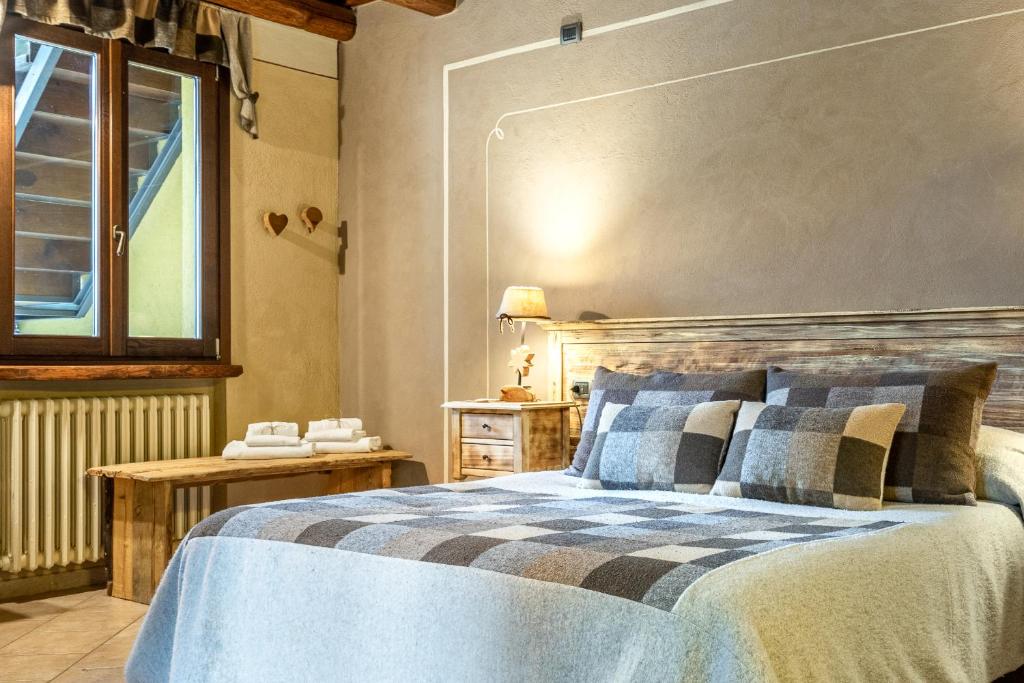 Postel nebo postele na pokoji v ubytování Cascina Veja