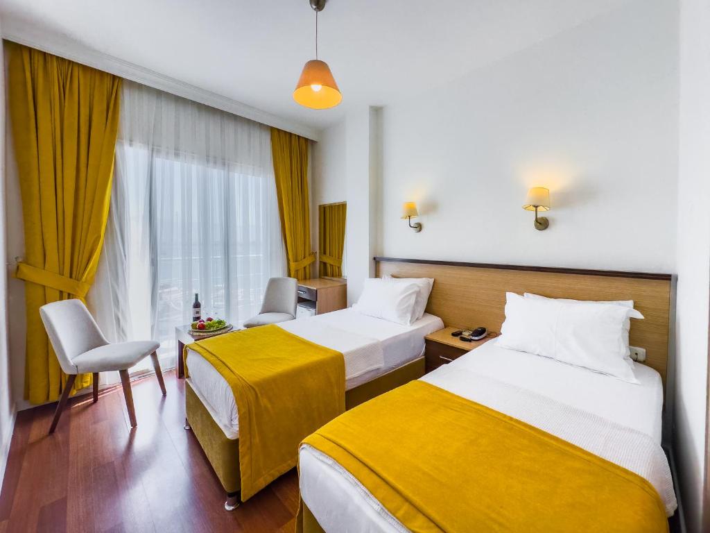 Postel nebo postele na pokoji v ubytování Dedeoğlu Port Hotel