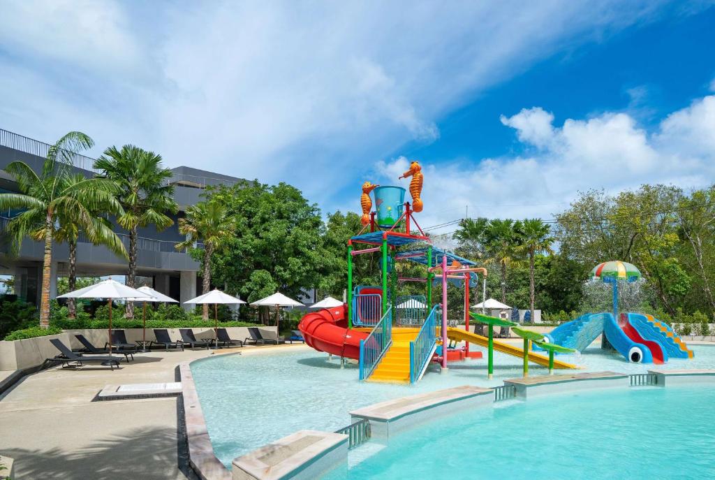 a swimming pool with a water park with a slide at Wyndham La Vita Rawai Phuket in Rawai Beach